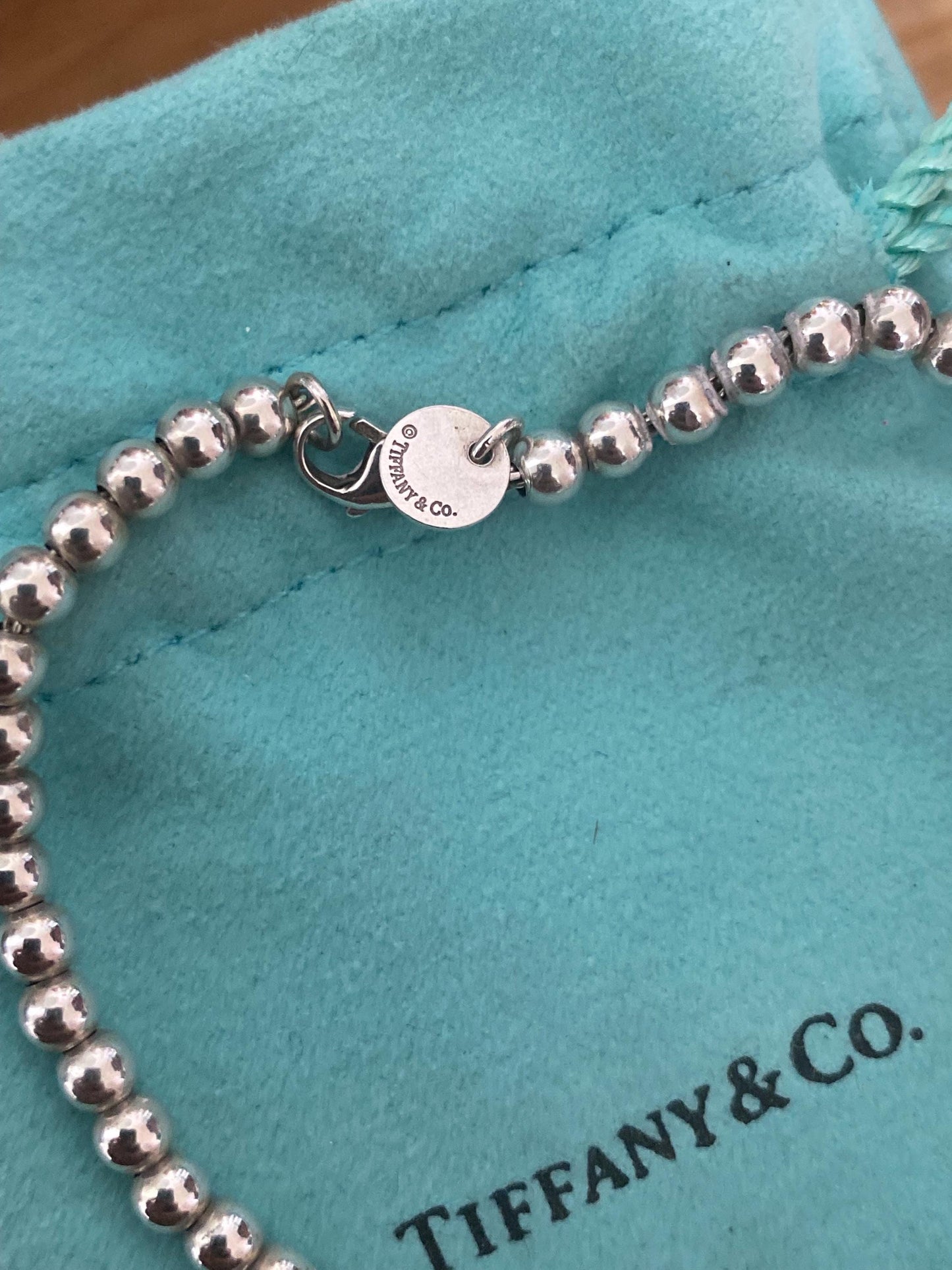 Tiffany & Co beaded sterling silver circle charm bracelet, Genuine, 7.5” long, with box and pouch