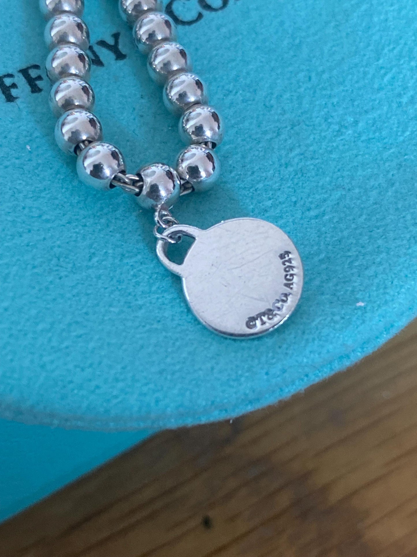 Tiffany & Co beaded sterling silver circle charm bracelet, Genuine, 7.5” long, with box and pouch