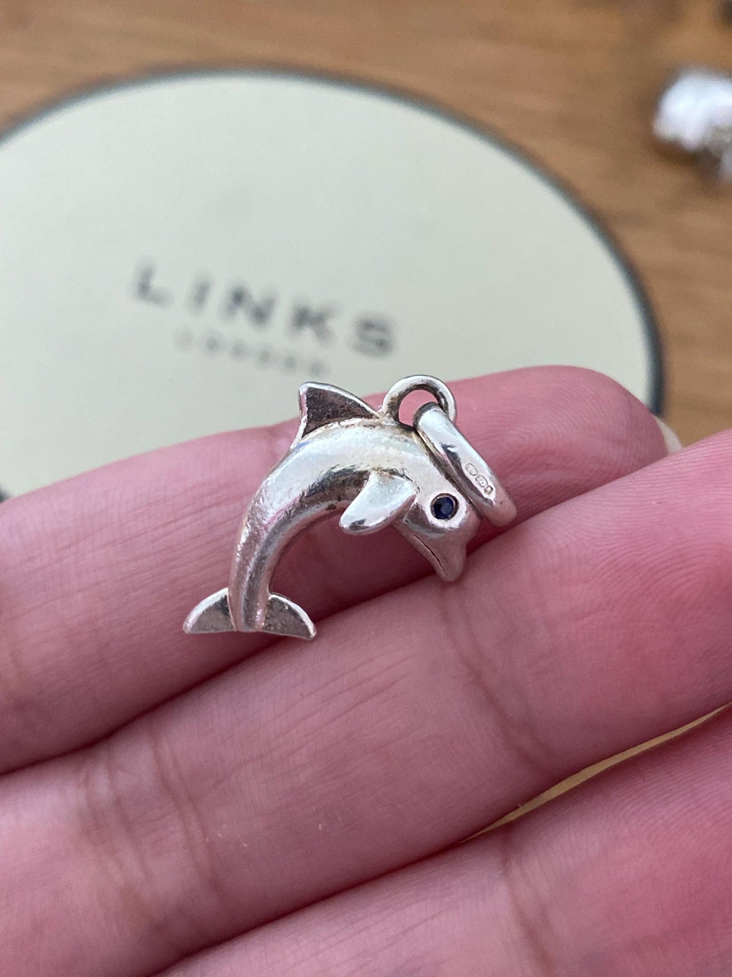 Stunning genuine rare Links of London sterling silver dolphin hallmarked charm with sapphire blue eyes