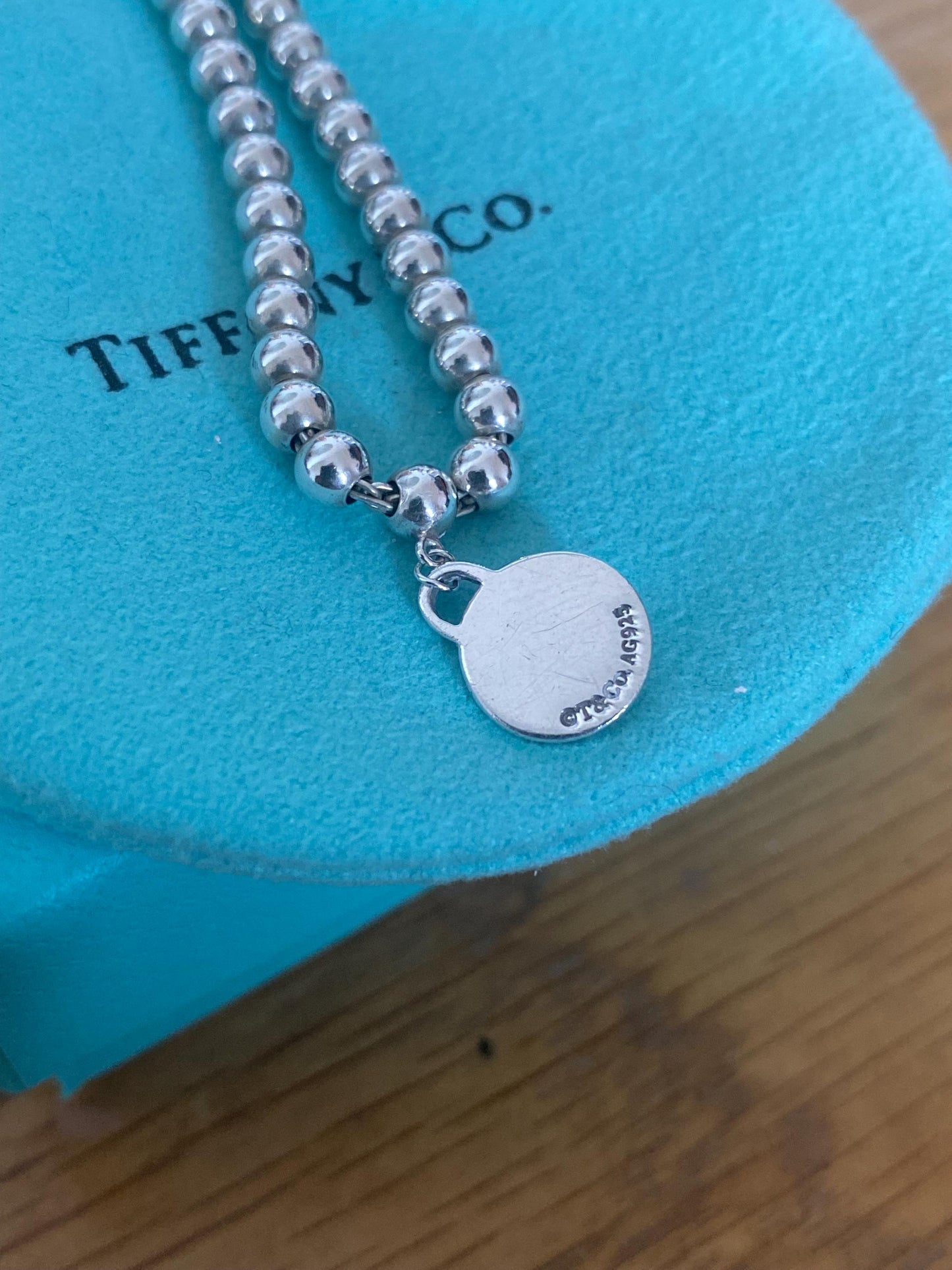 Tiffany & Co beaded sterling silver circle charm bracelet, Genuine, 7.5” long, with box and pouch