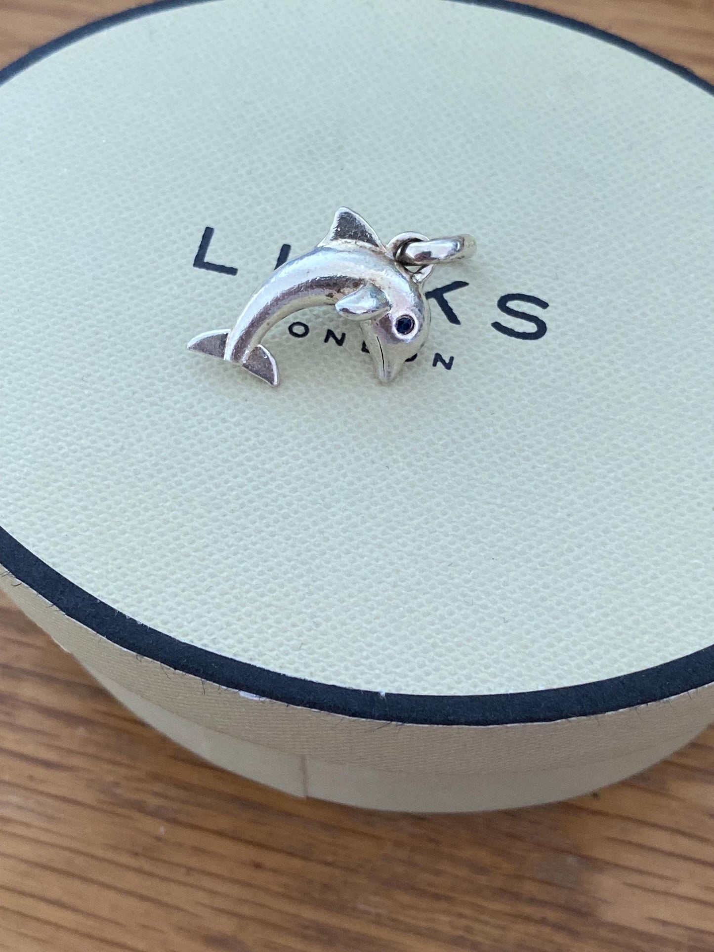 Stunning genuine rare Links of London sterling silver dolphin hallmarked charm with sapphire blue eyes