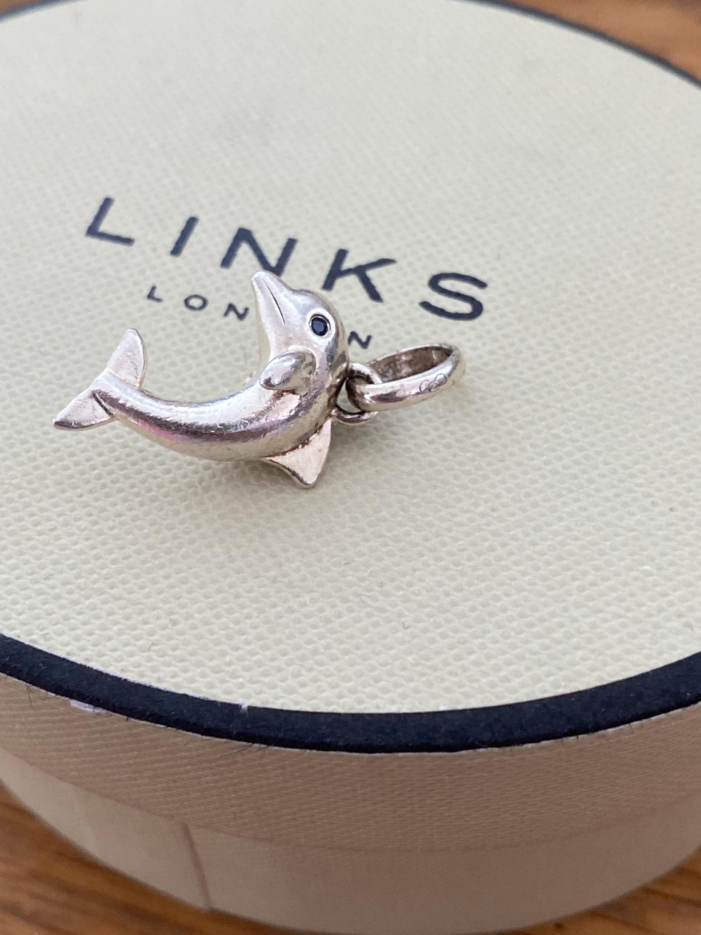 Stunning genuine rare Links of London sterling silver dolphin hallmarked charm with sapphire blue eyes