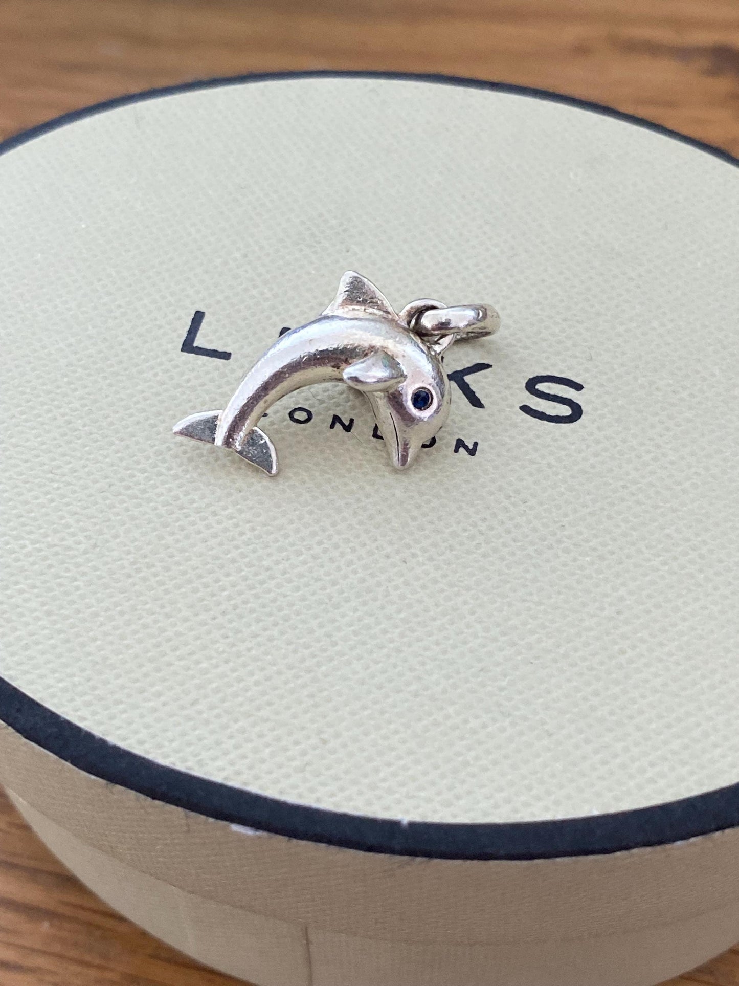 Stunning genuine rare Links of London sterling silver dolphin hallmarked charm with sapphire blue eyes