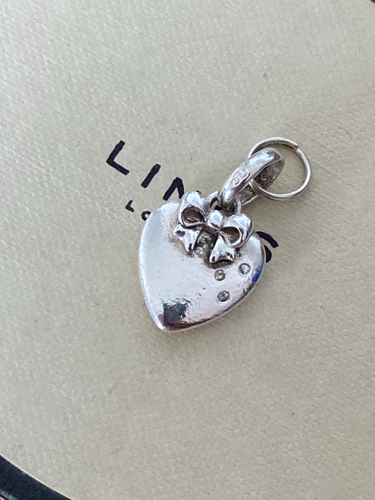Beautiful genuine rare hallmarked Links of London sterling silver heart charm with bow and topaz stones