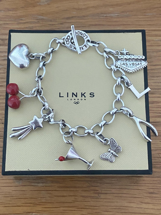 Gorgeous vintage and rare links of London toggle bracelet with 8 charms, hallmarked, sterling silver