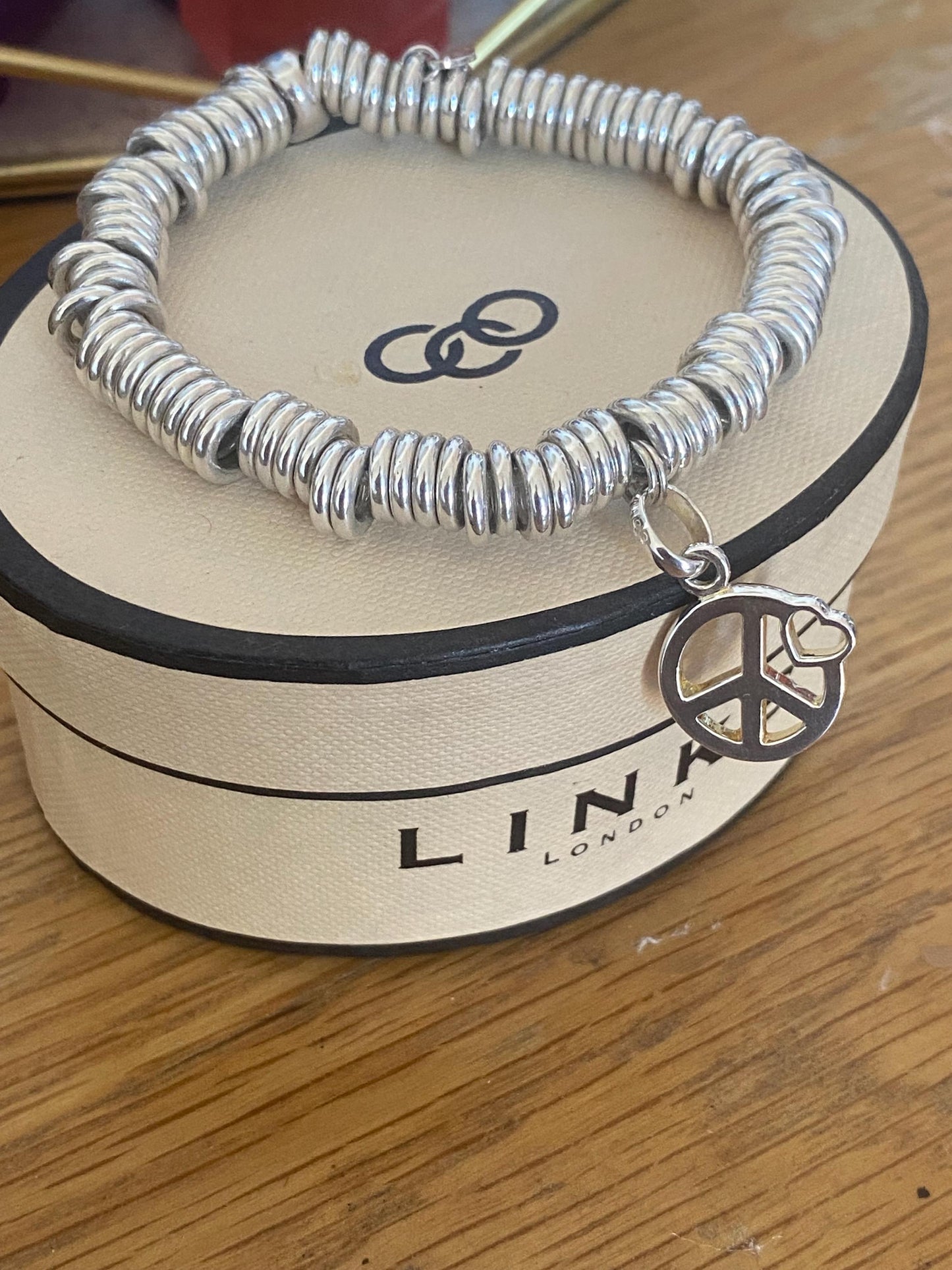 Lovely Links of London vintage rare sweetie bracelet witha peace heart charm, sterling silver, size medium, boxed