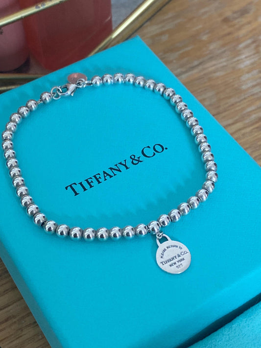 Tiffany & Co beaded sterling silver circle charm bracelet, Genuine, 7.5” long, with box and pouch