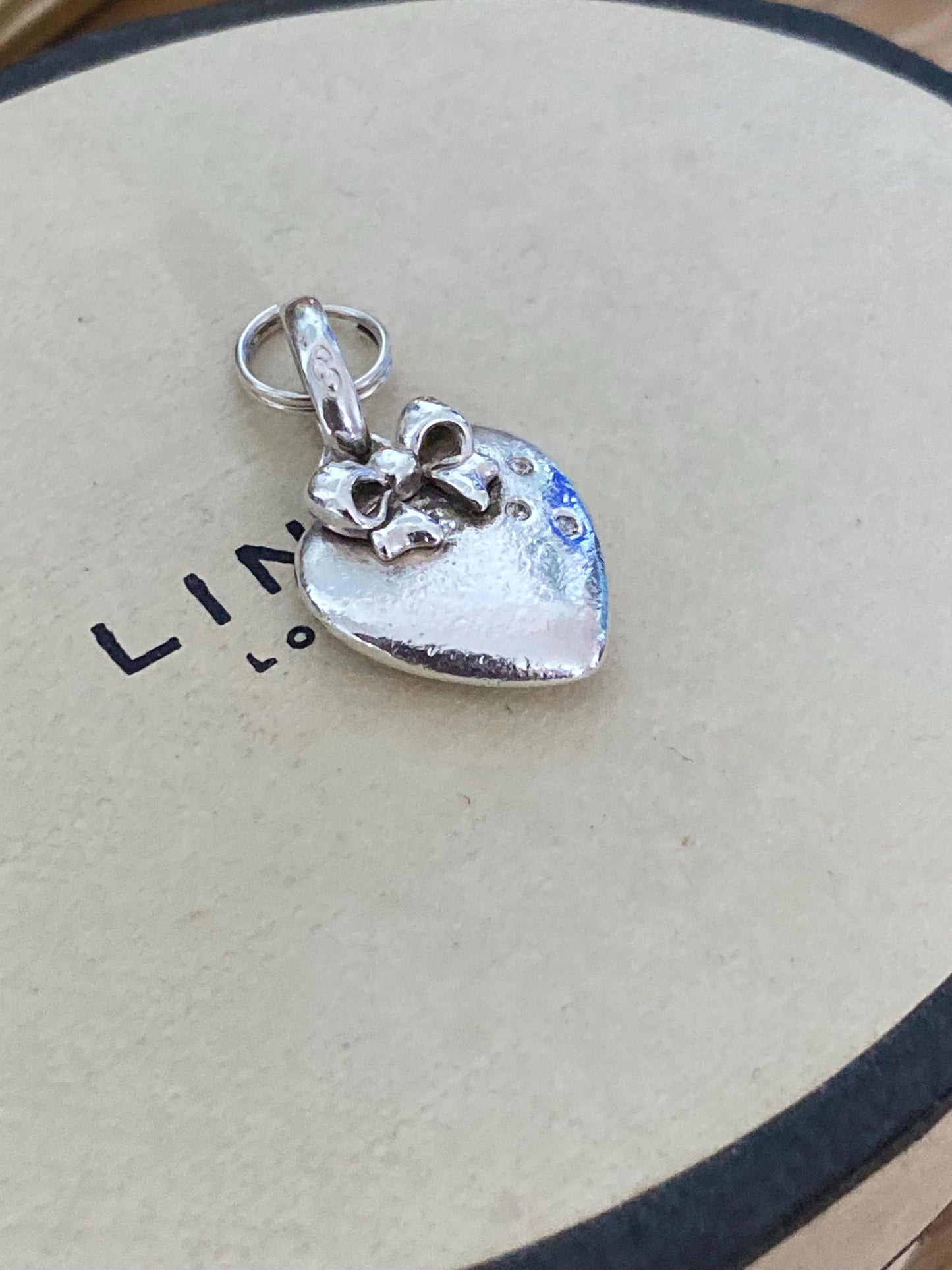 Beautiful genuine rare hallmarked Links of London sterling silver heart charm with bow and topaz stones